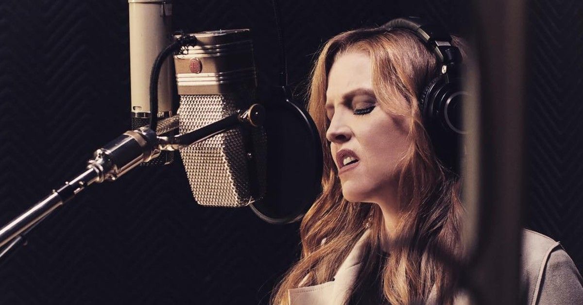 Lisa Marie Presley records a song into a microphone