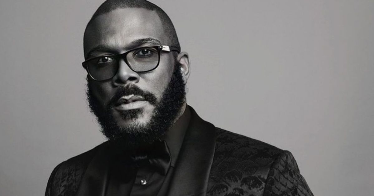 Black and white picture of Tyler Perry in a black suit.