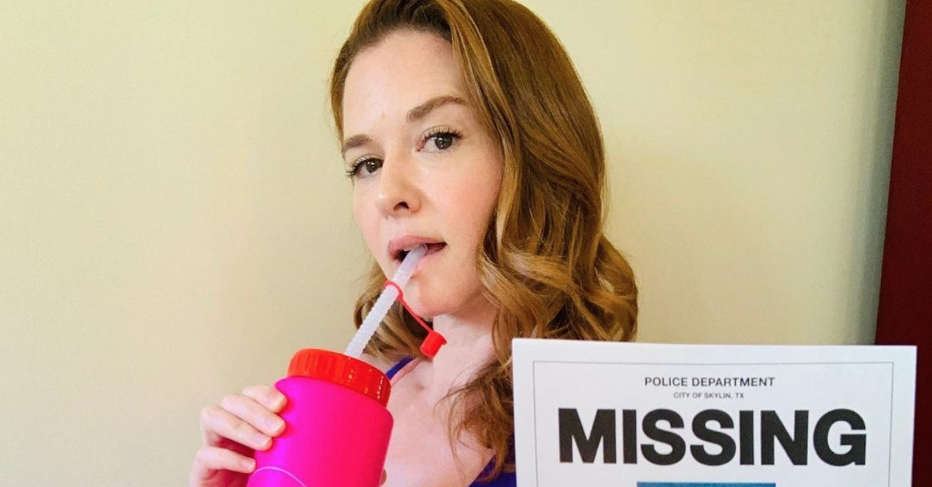 sarah drew holding a missing poster