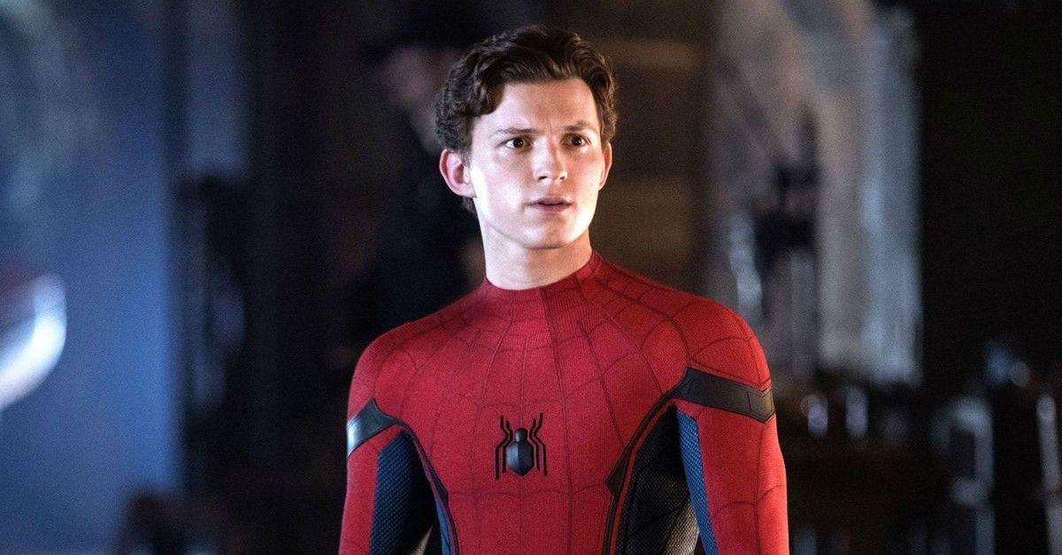 Tom Holland stands in his Spider-Man suit