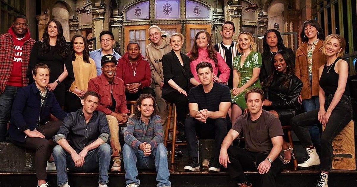 The cast of Saturday Night Live season 46 posing on the stage at studio 8H
