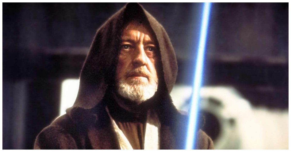 Alec Guinness as Obi Wan with lightsaber in Star Wars
