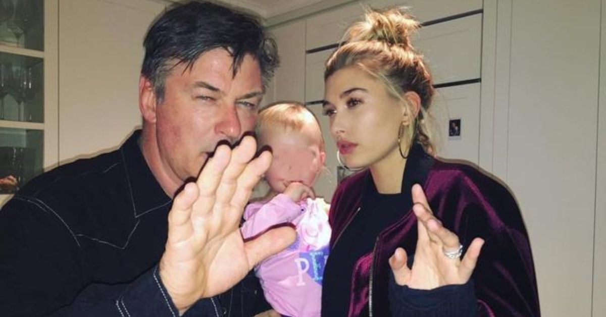 Alec Baldwin and Hailey Bieber hold up their hands to the camera