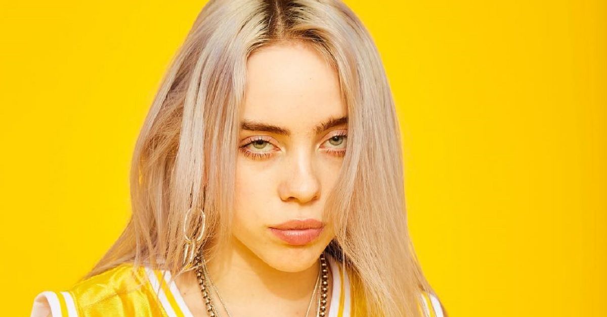 Billie Eilish looking sultry while in a Yellow Outfit