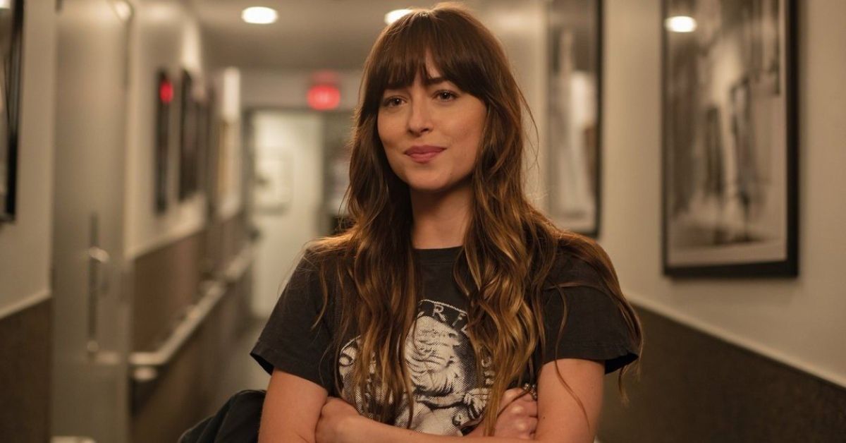 Dakota Johnson crosses her arms in the movie High Note