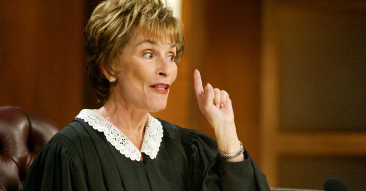 Judge Judy looking serious and pointing on her TV show