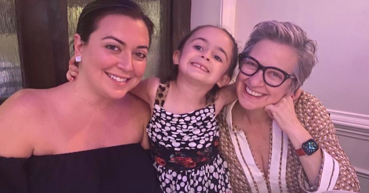 Lauren Manzo, Lauren's daughter Markie, and Caroline Manzo from RHONJ posing with their arms around each other