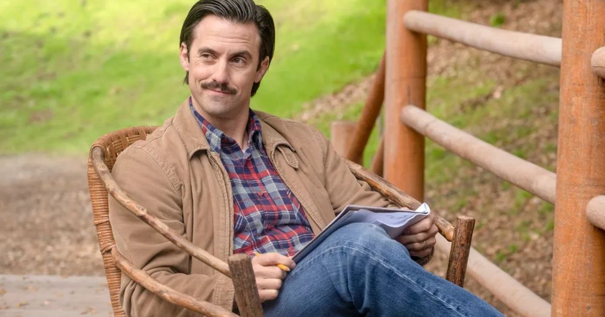 Milo Ventimiglia smiling and sitting outside as Jack Pearson on This Is Us