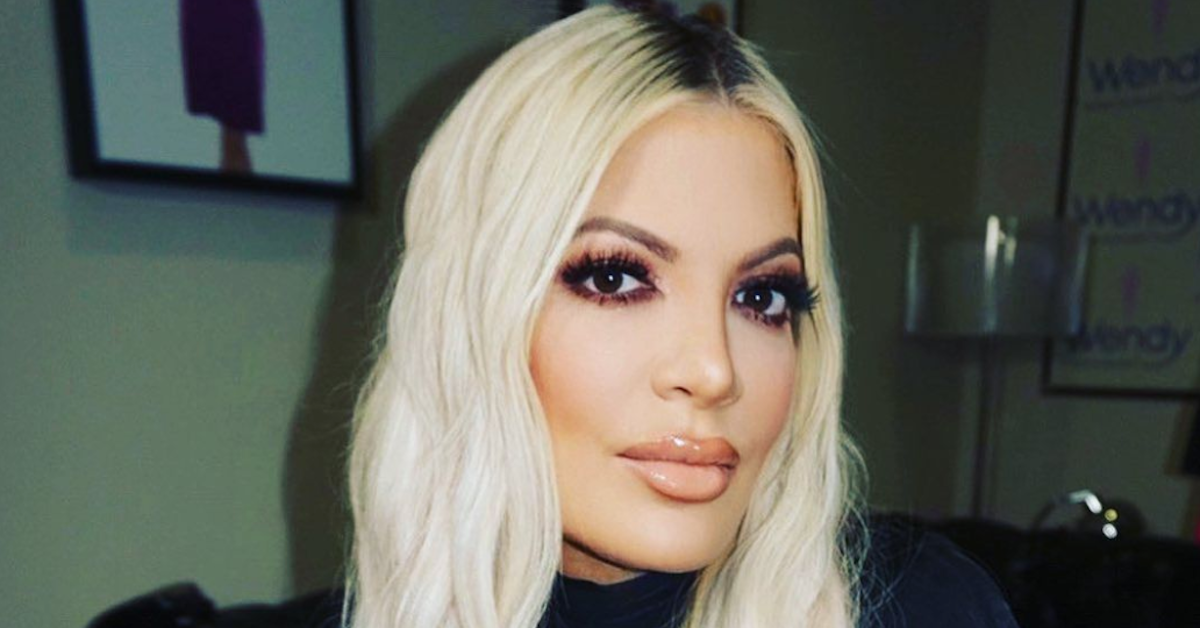 Tori Spelling wearing heavy makeup and posing for a flashy photo on Instagram