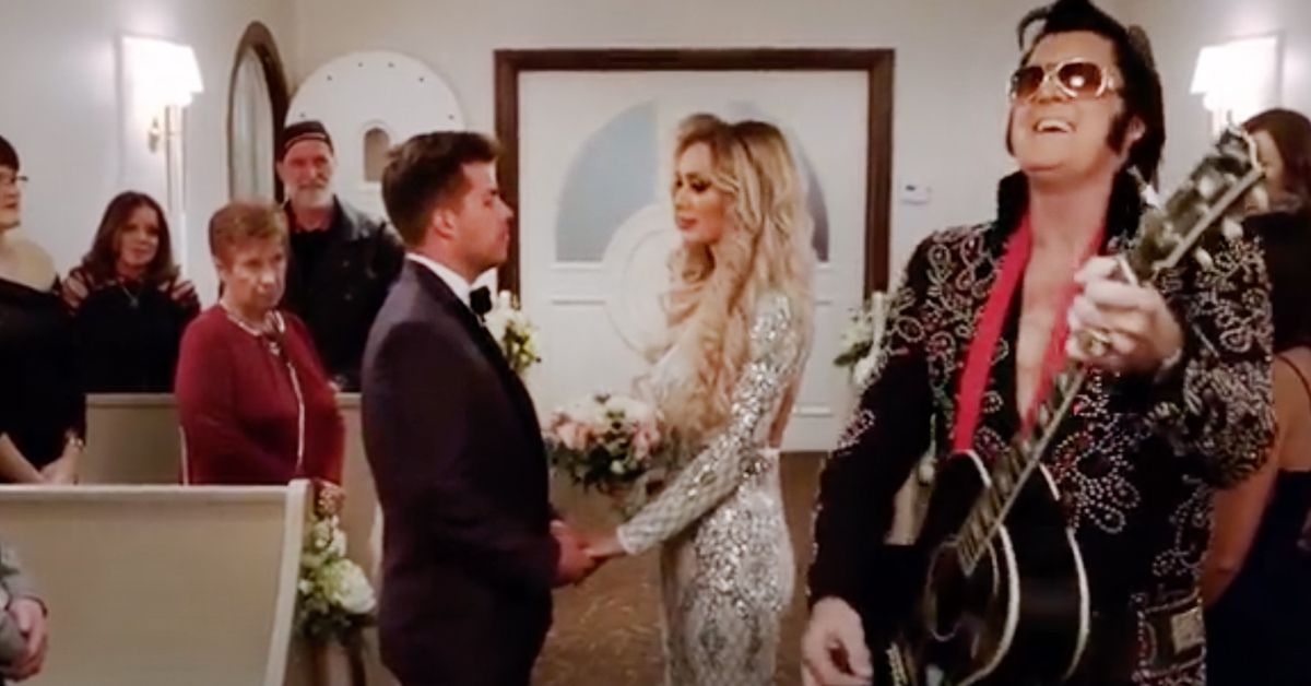 Yara and Jovi standing next to each other and an Elvis impersonator during their Vegas wedding.