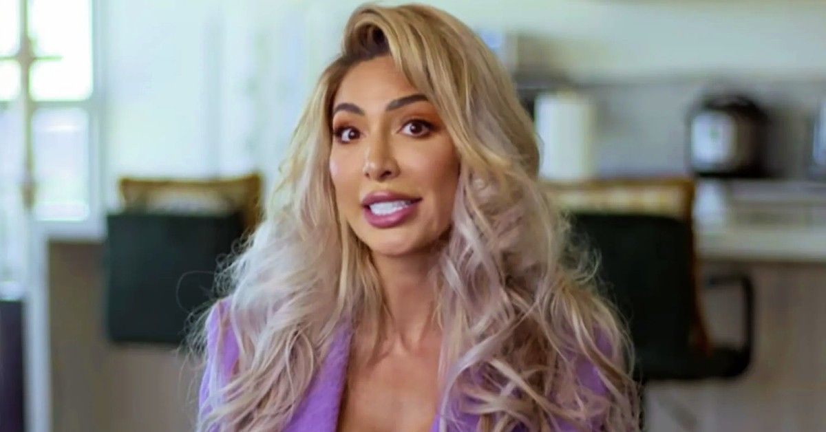 Farrah Abraham with long blonde hair wearing purple top sits in interview setting