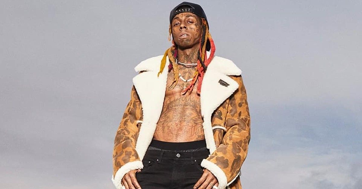 Lil Wayne shirtless with an aggressive facial expression