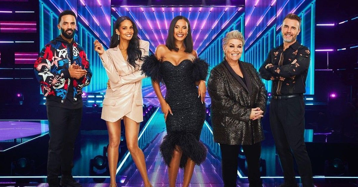 Judges of ITV show Walk the Line stand together on lit up stage