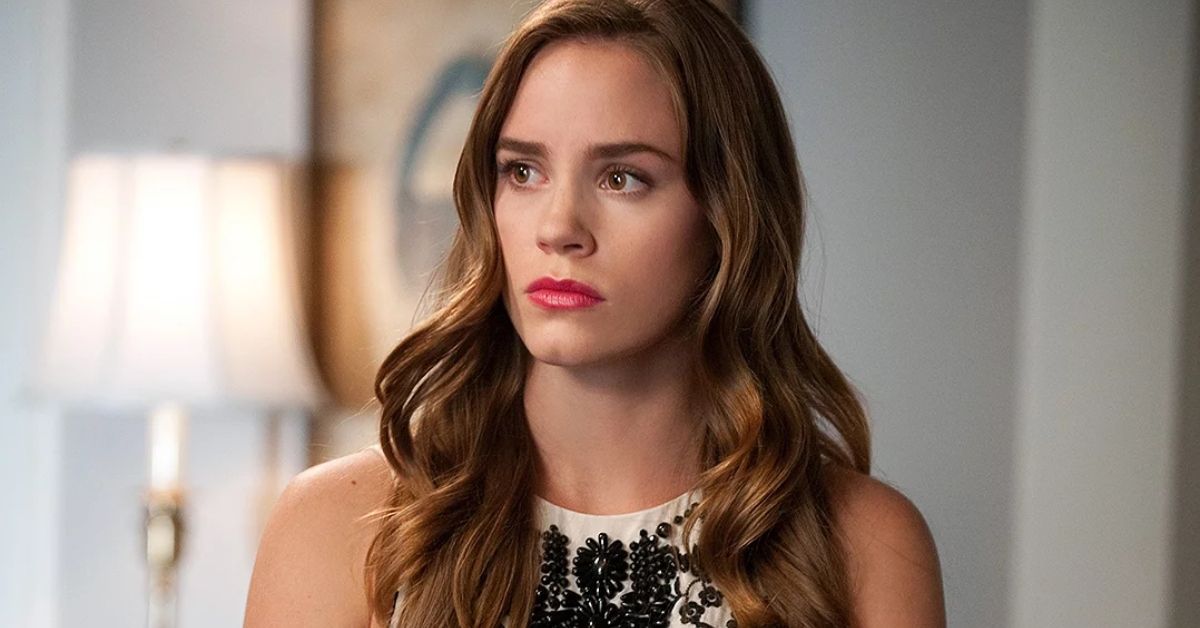 An image of Christa B Allen looking serious as Charlotte Grayson on Revenge