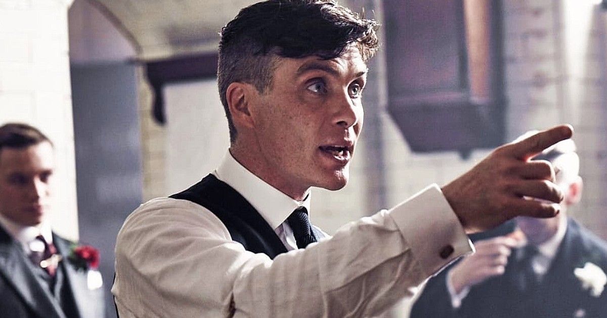 Cillian Murphy starring as Thomas Shelby in Peaky Blinders, points a finger forward.
