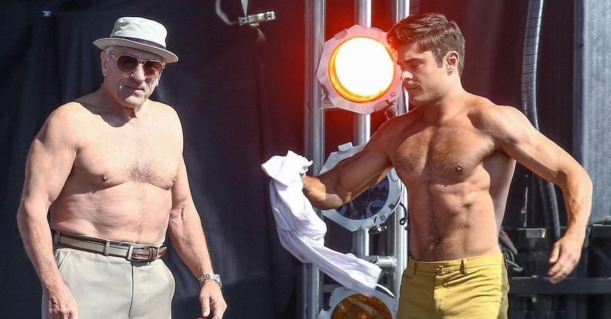 Robert de Niro and Zac Efron shirtless in a muscle contest in the movie Bad Grandpa