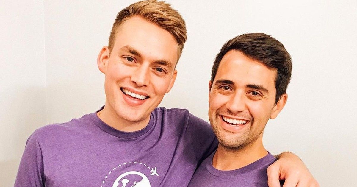 Will Jardell and James Wallington in matching purple t-shirts in front of white background