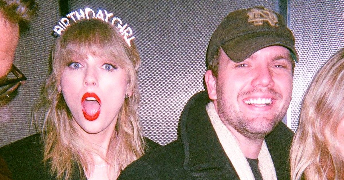 Taylor Swift with Birthday Girl head band stands mouth opened next to her brother Austin Swift