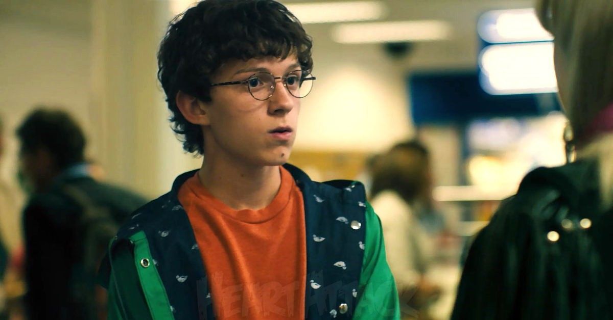 Young Tom Holland in hoodie and glasses for scene from How I Live Now