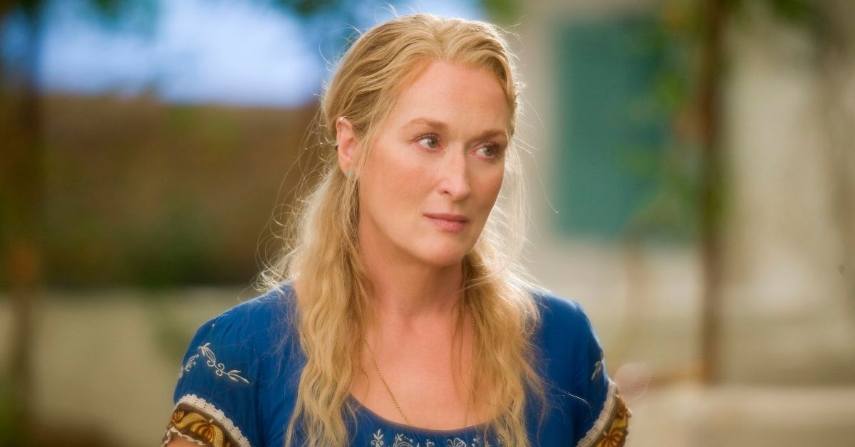 Meryl Streep as Donna in Mamma Mia! wearing blue top with long, blonde hair