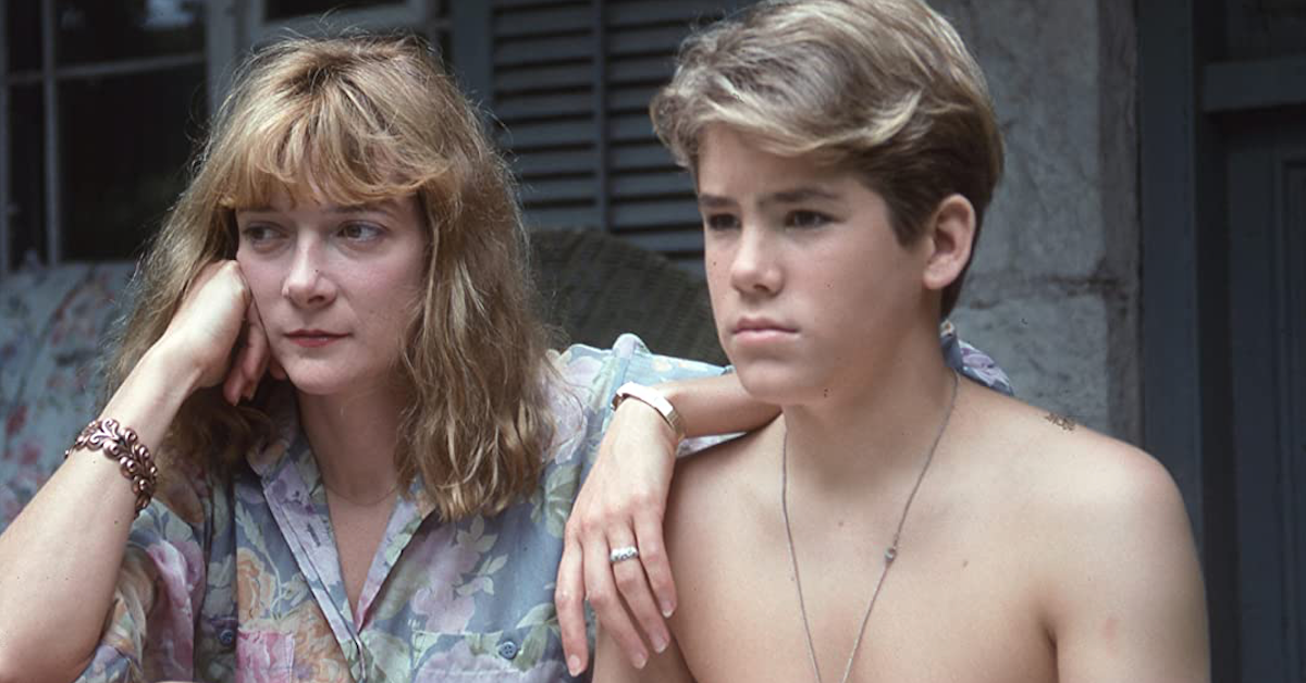 A young Ryan Reynolds sits next to Glenne Headly in the film Ordinary Magic, his first film role