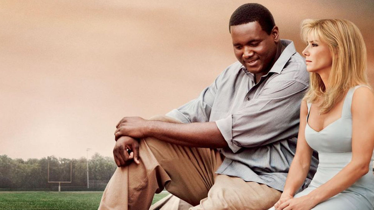 The Blind Side movie poster - Leigh Anne Tuohy and Michael Oher on a football field