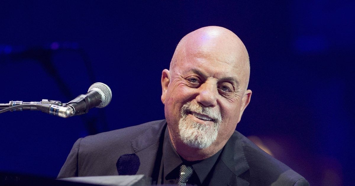 Billy Joel on stage at his piano