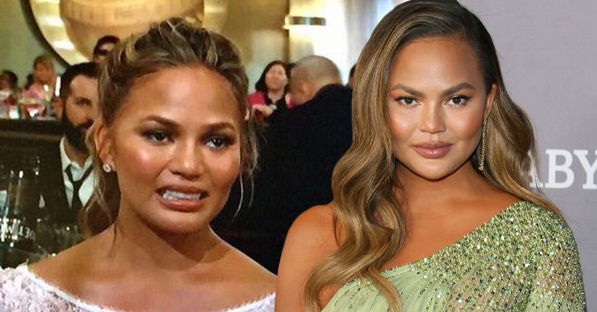 Chrissy Teigen making an awkward face at an awards show and posing on a red carpet