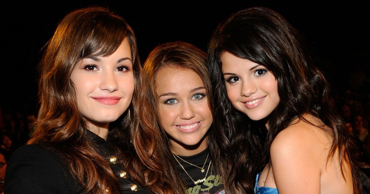 Host Miley Cyrus (center) with Demi Lovato and Selena Gomez during the 2008 Teen Choice Awards at Gibson Amphitheater on August 3, 2008 in Los Angeles, California.