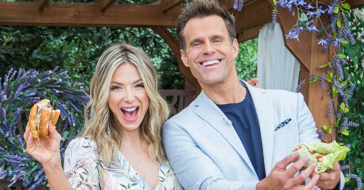 Debbie Matenopoulos and Cameron Mathison smiling with food