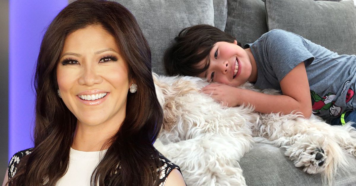TV host Julie Chen and her son Charlie cuddling with a dog