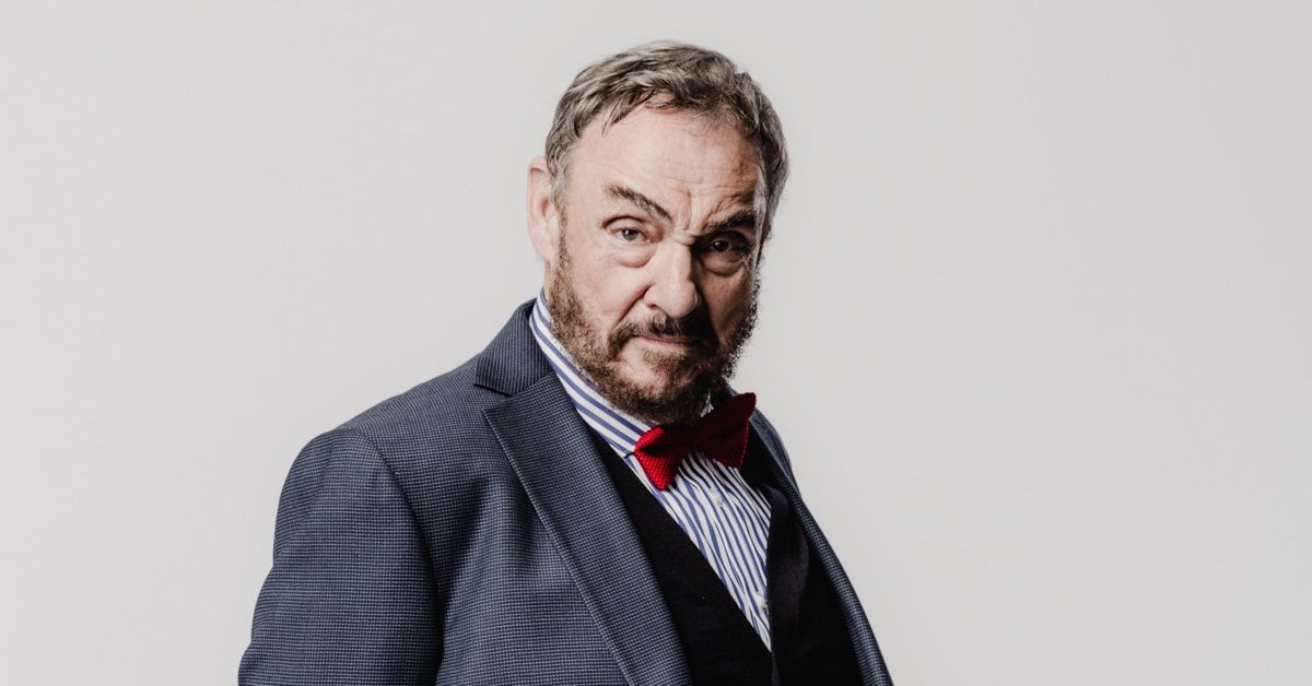 John Rhys-Davies photoshoot in front of a grey background