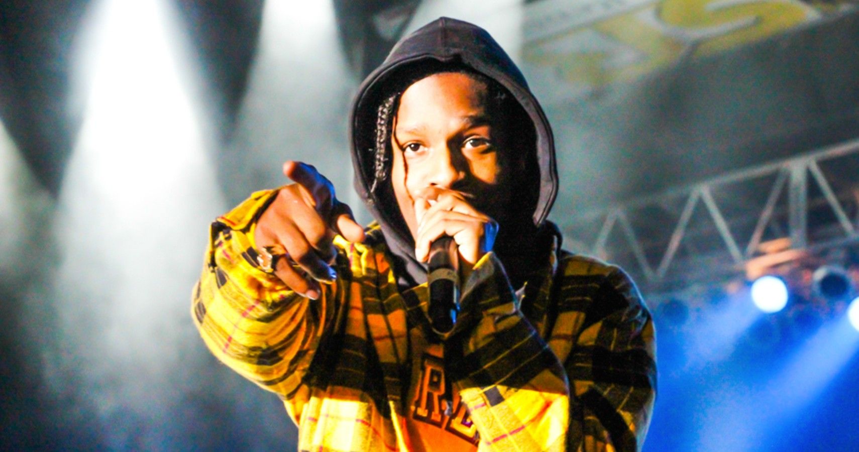 ASAP Rocky in yellow plaid jacket with microphone