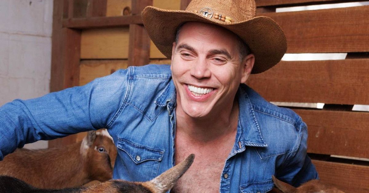 Steve-O in cowboy hat with goats