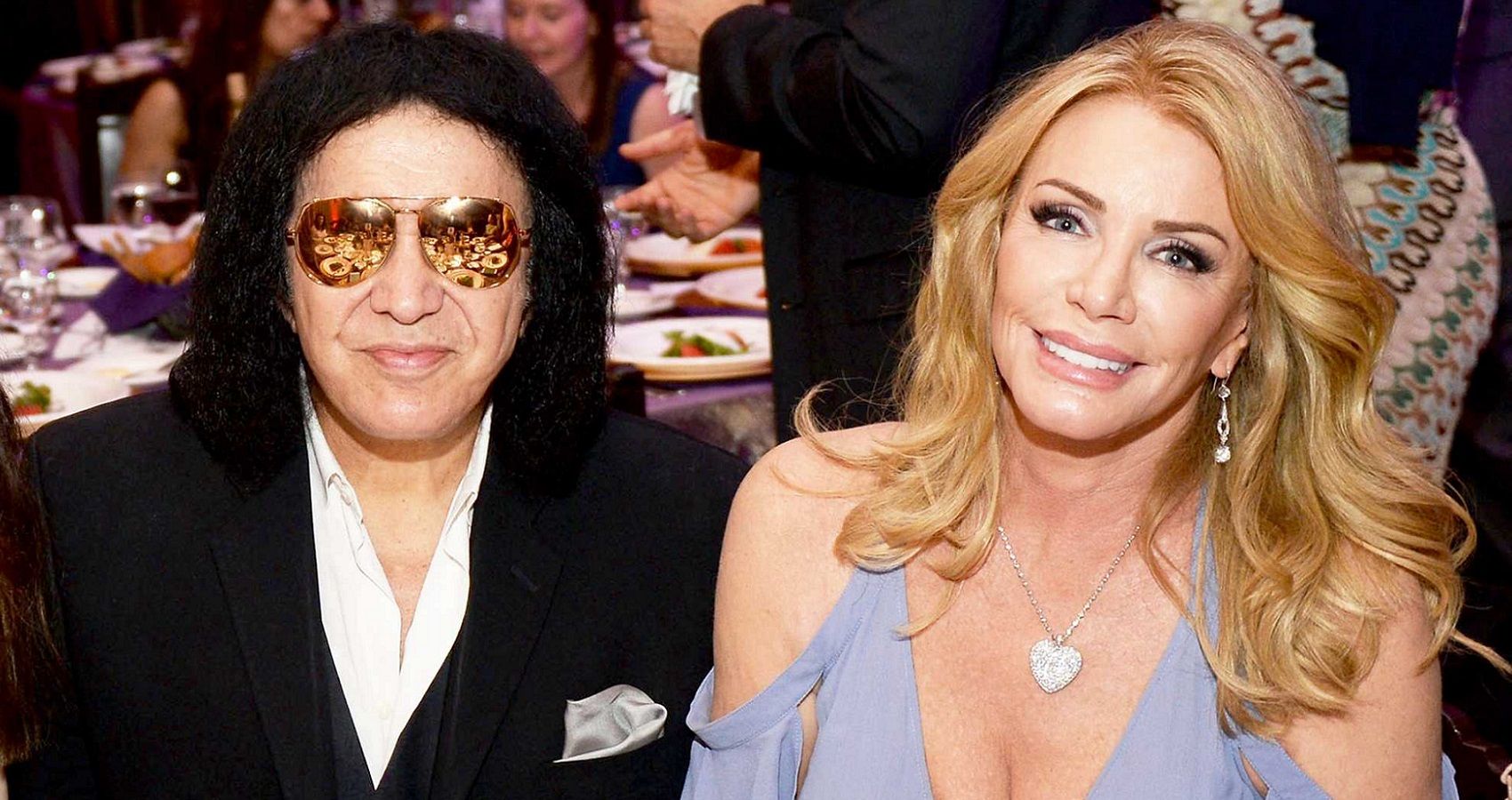 Shannon Tweed and Gene Simmons seated side by side at a table