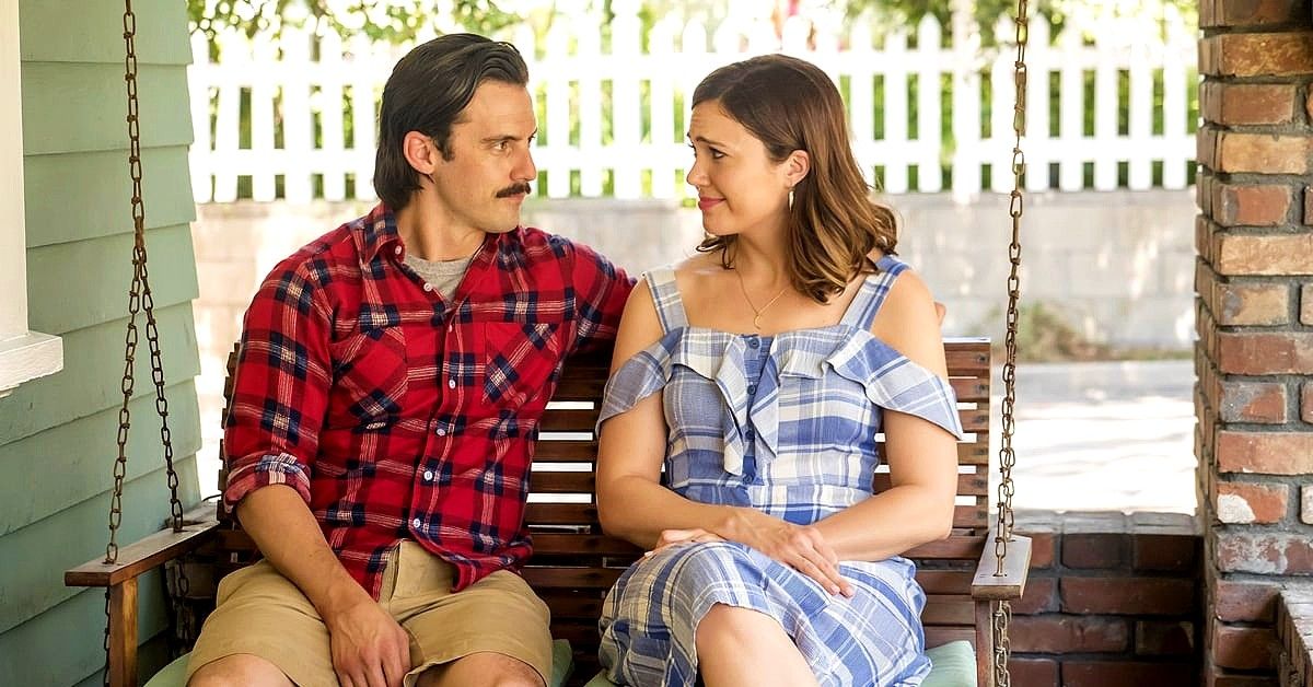 This Is Us Milo Ventimiglia and Mandy Moore sitting on porch swing as Jack and Rebecca Pearson