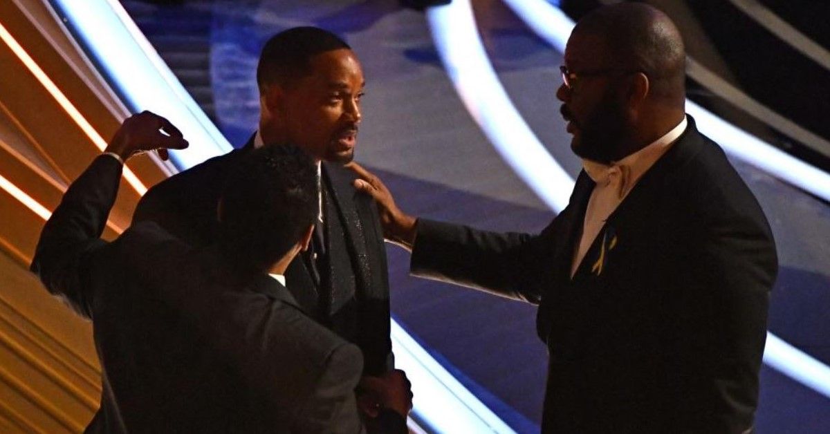 Will Smith and Tyler Perry pictured at the Oscars following the onstage incident involving Smith and Chris Rock