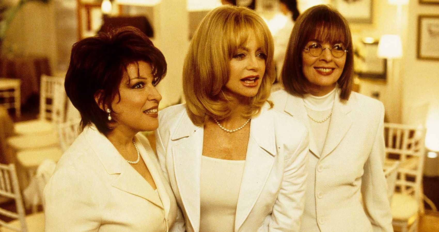 First Wives Club cast Diane Keaton, Goldie Hawn, and Bette Midler in white outfits