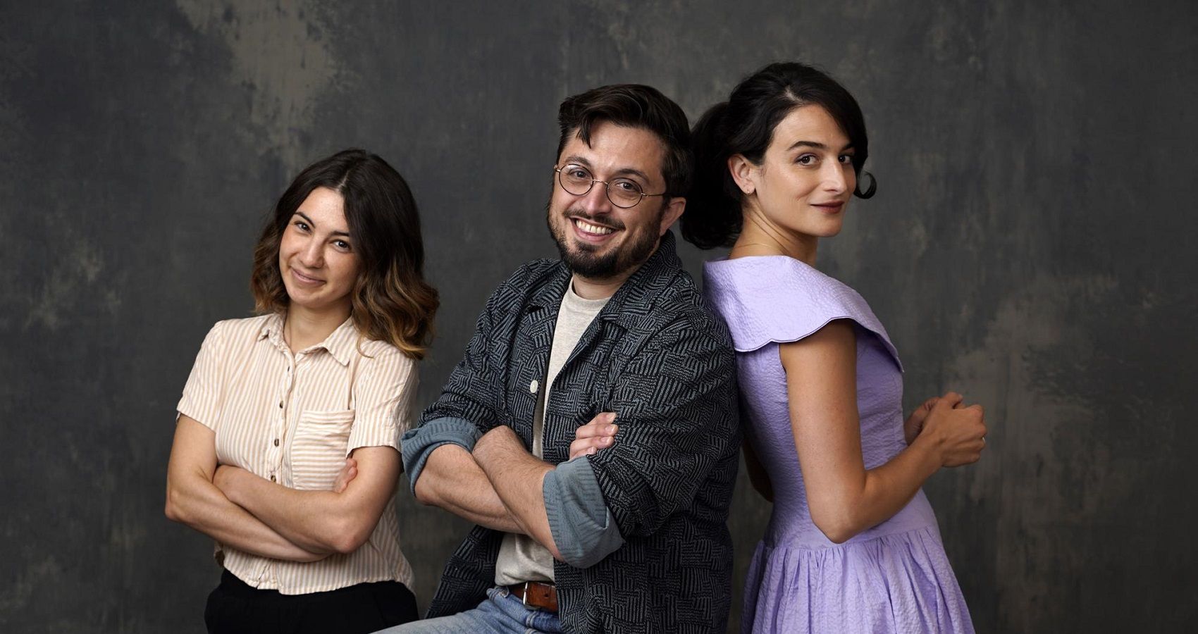 Jenny Slate, Dean Fleischer-Camp, and Kristen Lepore photoshoot in front of a grey background