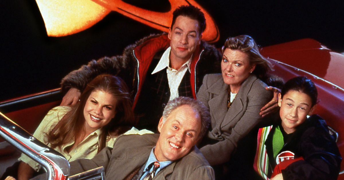 The Cast of 3rd Rock from the Sun riding in a car.