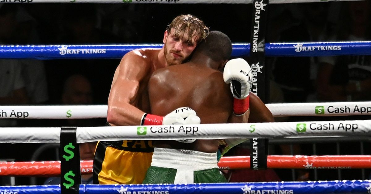 Logan Paul and Floyd Mayweather hugging after their fight