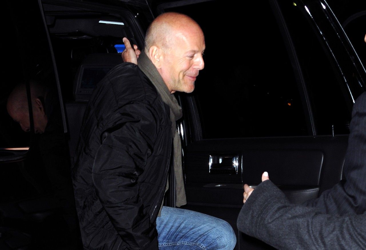 Bruce Willis exiting a car