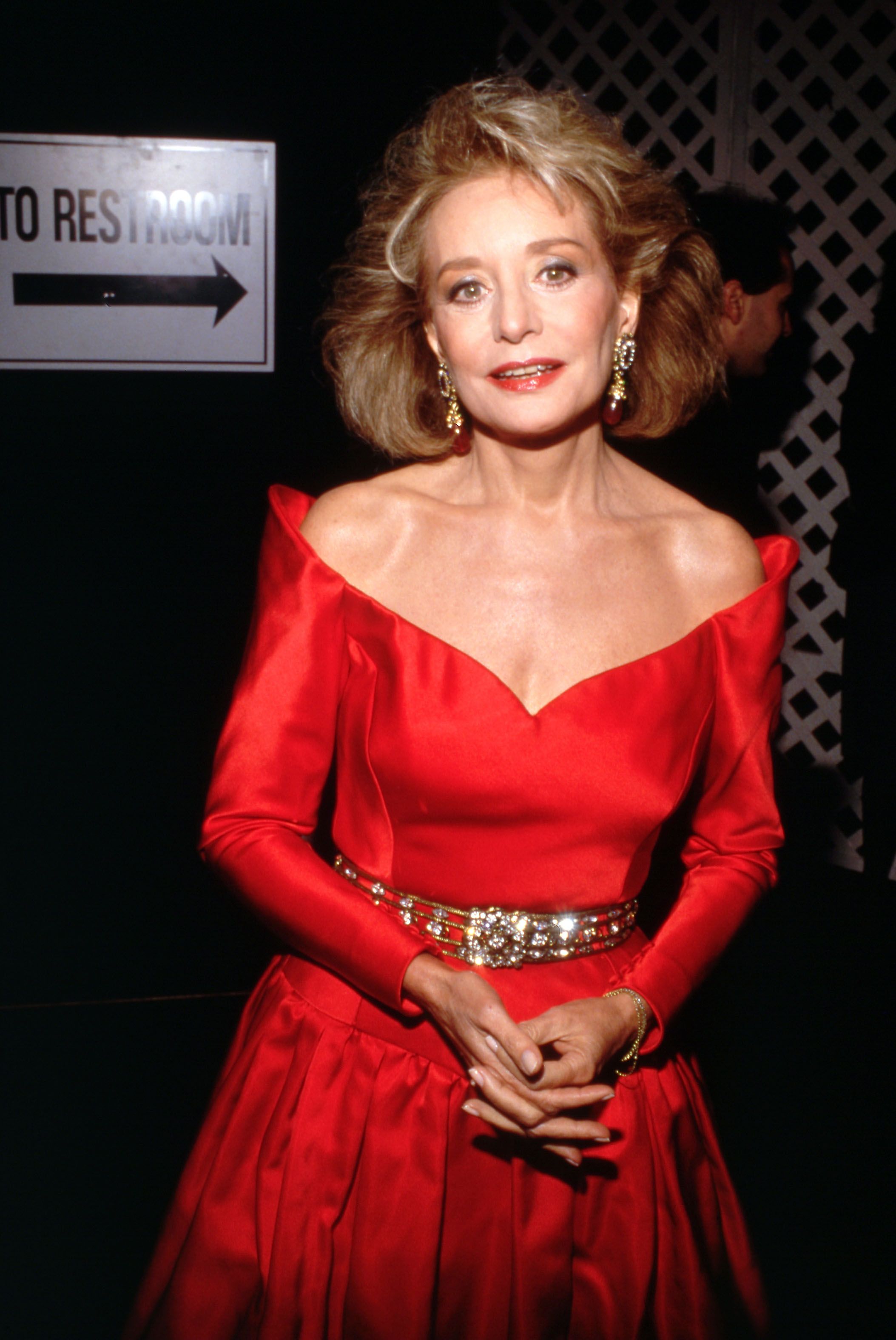 Barbara Walters wearing a red dress