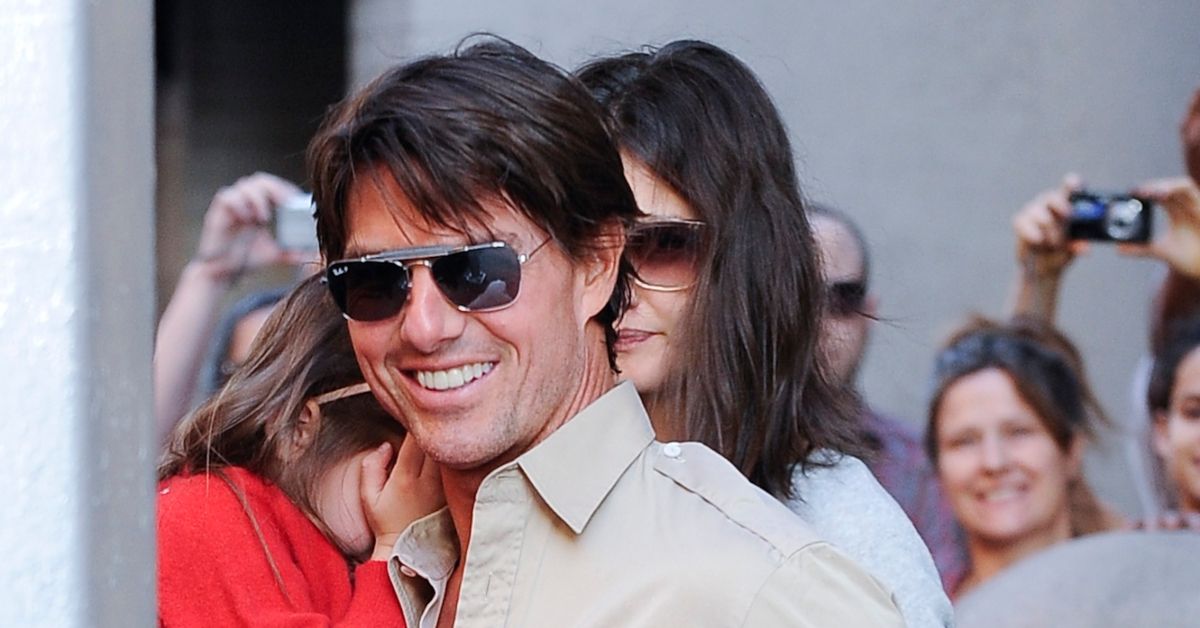 Tom Cruise, Katie Holmes, and Suri Cruise on a city street
