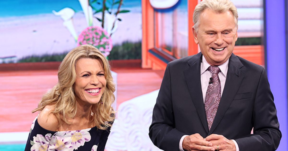 Vanna White and Pat Sajak laughing on Wheel Of Fortune