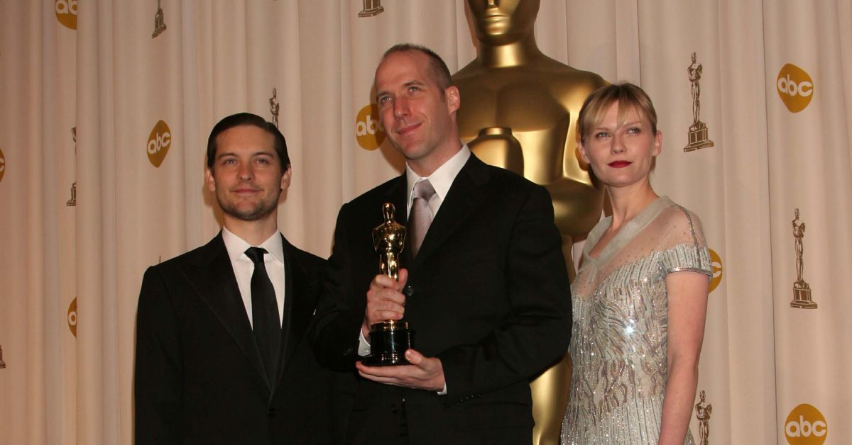 Tobey Maguire, Michael Arndt, and Kirsten Dunst at the Oscars