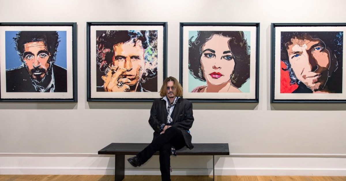 Johnny Depp with his paintings