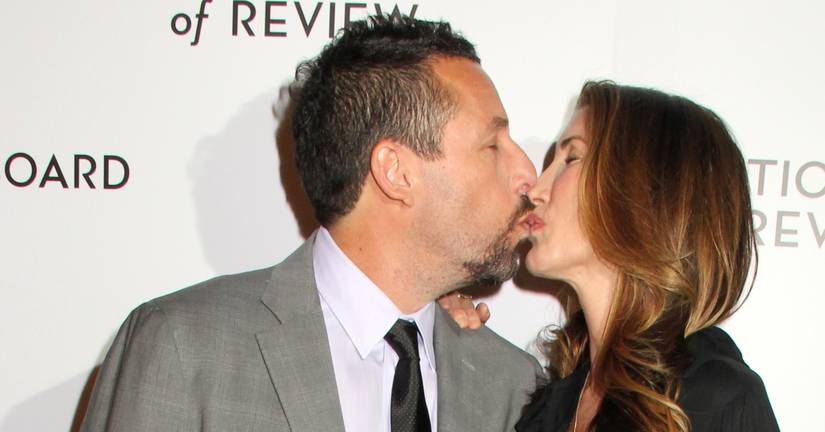 Adam Sandler and Jackie Sandler kissing