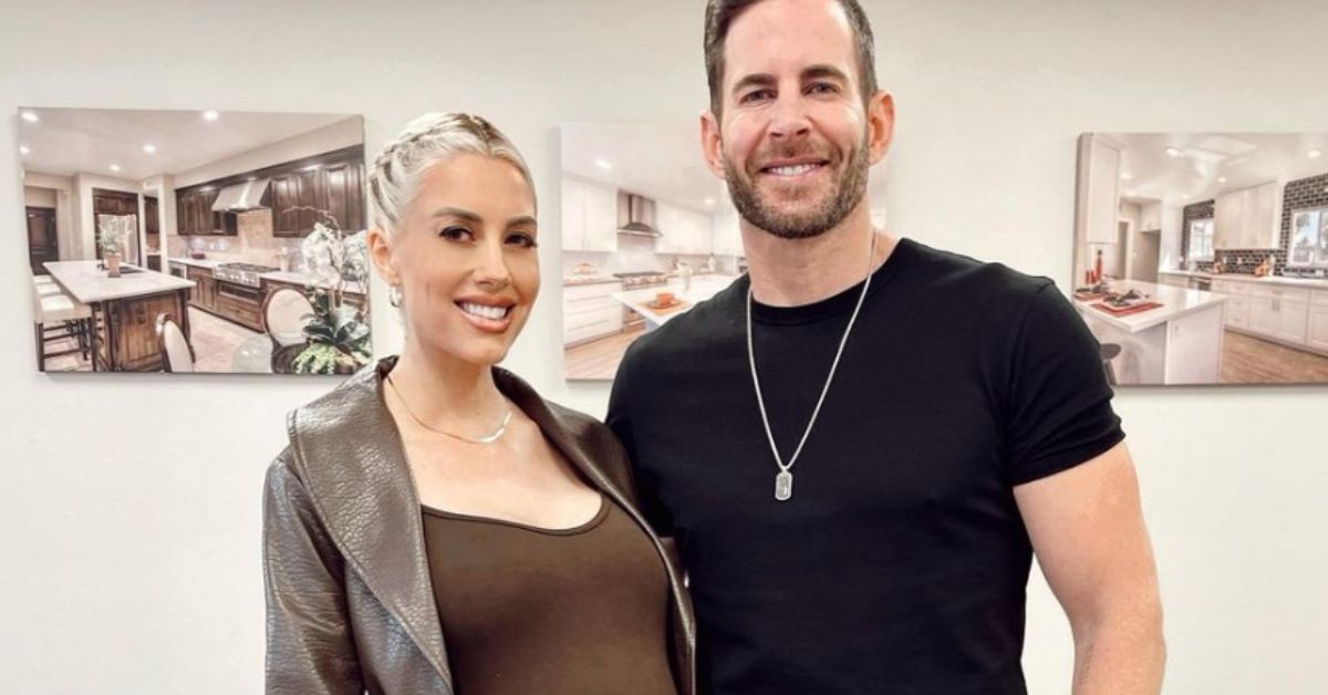 Heather and Tarek El Moussa standing together smiling