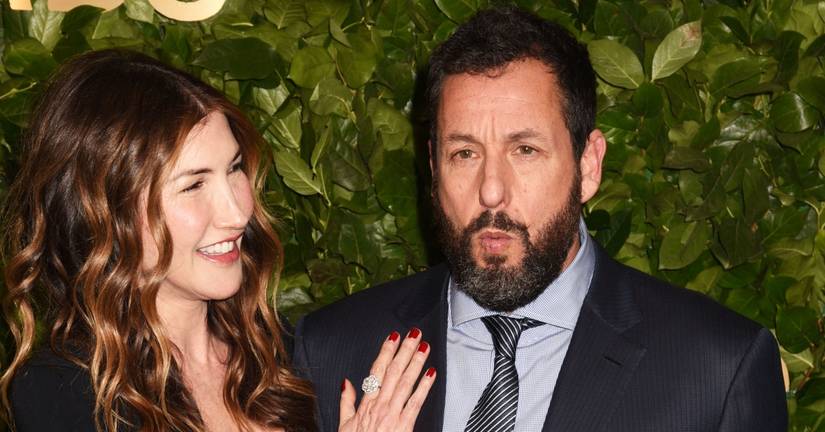 Jackie Sandler and Adam Sandler pose for photos